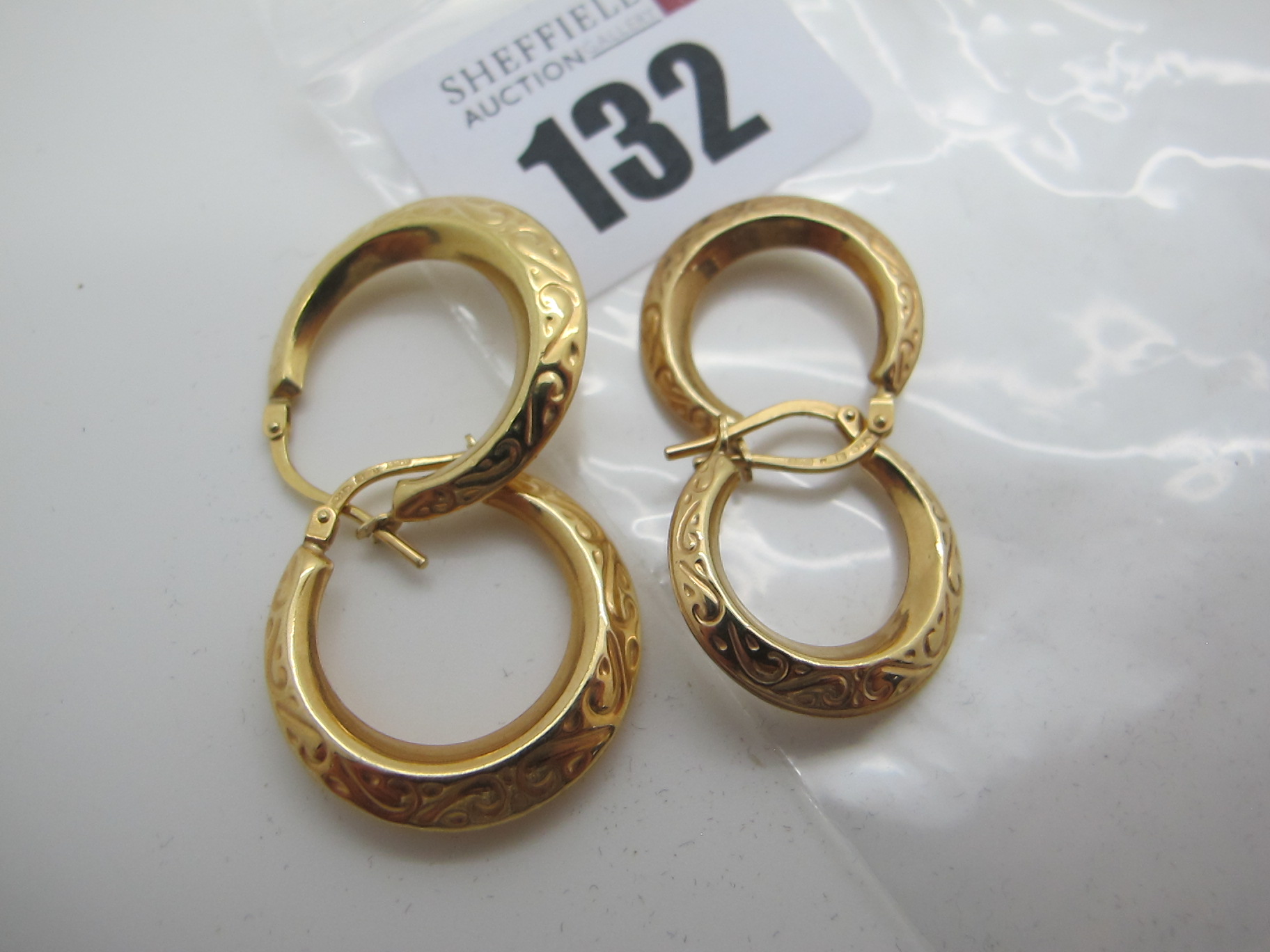 Two Pairs of Modern Hoop Earrings, stamped "375" (2.9grams). (2)