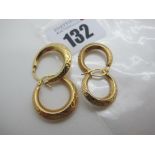 Two Pairs of Modern Hoop Earrings, stamped "375" (2.9grams). (2)