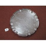 A Hallmarked Silver Salver, JGLtd, Birmingham 1973, of shaped circular form, raised on three