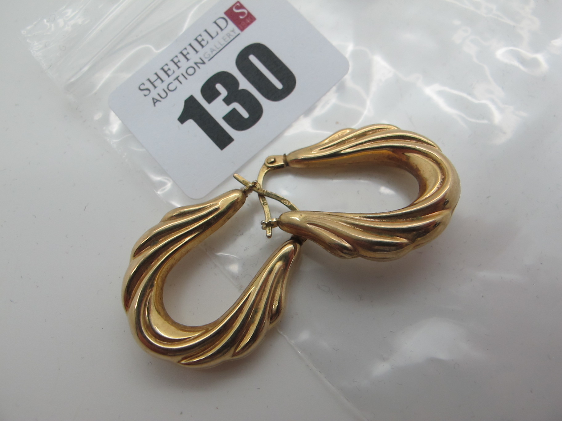 A Pair of Modern Earrings, stamped "375" (2.1grams).