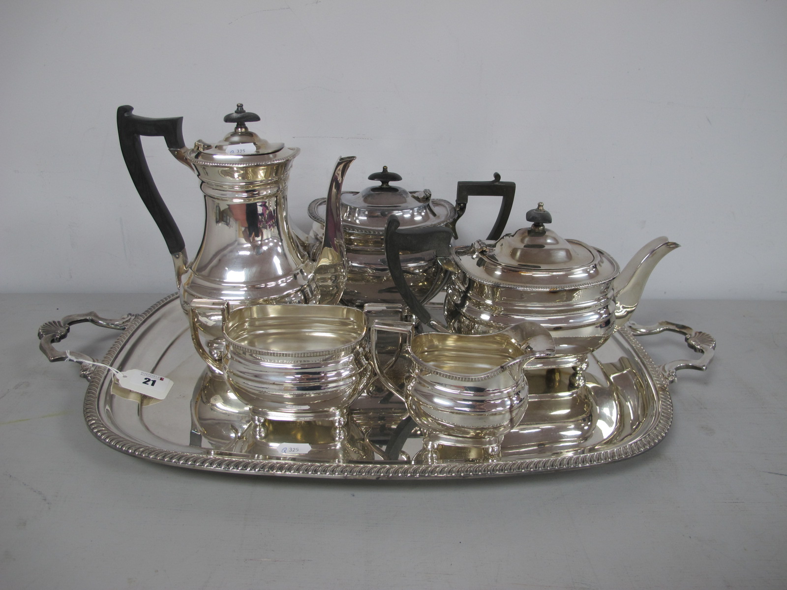 A Silver Jubilee 1977 Twin Handled Plated Tray, together with a plated four piece tea set (