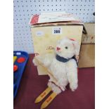 A Steiff Teddy Bear 'Skier', limited edition No 218/1500, white mohair body, hat, scarf, wooden
