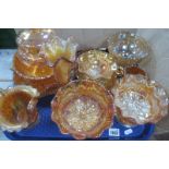 A Pair of Orange Carnival Glass Pedestal Bowls, with wavy rims, bowls, etc:- One Tray