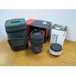 A Sigma Lens 105 F2.8 Macro Ex. AF Filter size 58, boxed, Canon extender EF 1.4 x 11 boxed. (2).