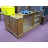 An Oak Rectangular Bookcase, with glass sliding doors, together with a pine two door cupboard. (2).