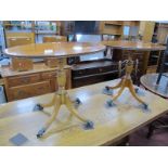 A Pair of XX Century Yew Wood Oval Shaped Wine Tables, turned pedestals, on splayed supports. (2).