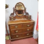 A XIX Century Mahogany Dressing Table, with scroll supports to oval mirror, four jewel drawers,