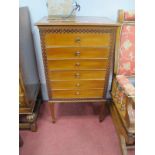 An Early XX Century Mahogany Music Cabinet, with six fall front drawers, blind fretwork surrounds,