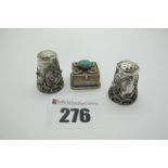 A Decorative "Mexico 925" Thimble, with applied decoration; together with another thimble,