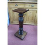 A Stained Mahogany Jardiniere, with a square top, turned reeded pedestal, square base, 74cm high
