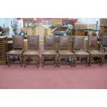 A 1920's Set of Six Oak 'Pineapple' Chairs, with brown leather back and seats, cup-cover and block