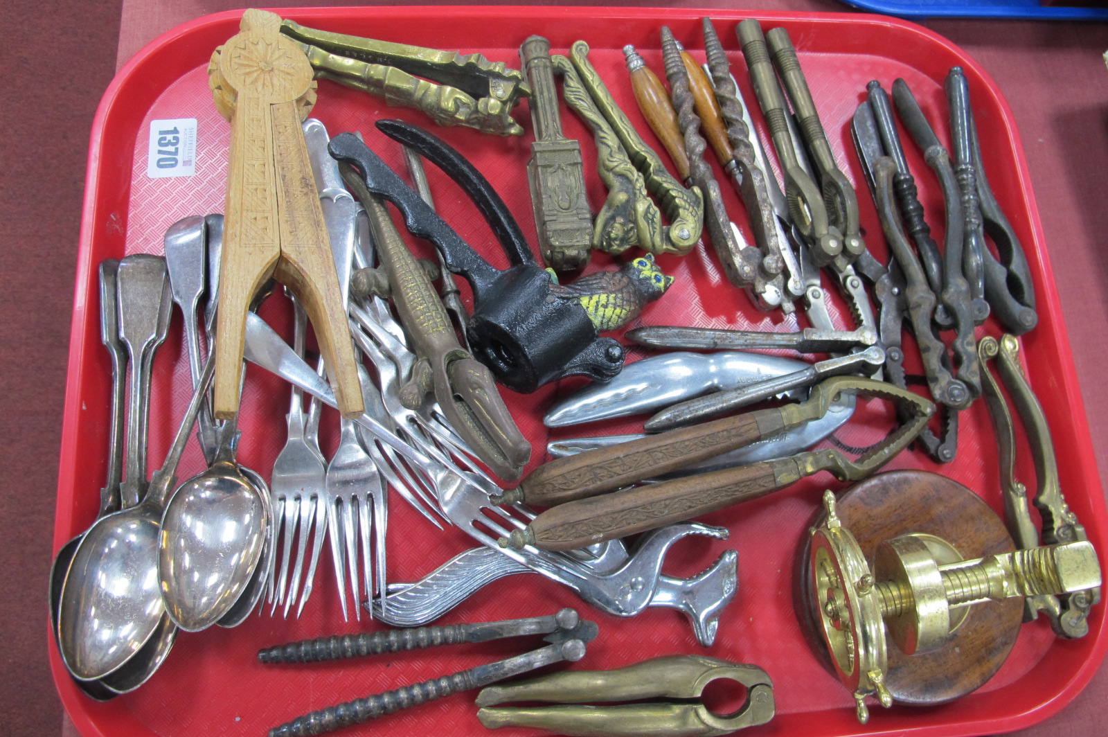 A Collection of Nut Crackers, plated cutlery, etc:- One Tray.