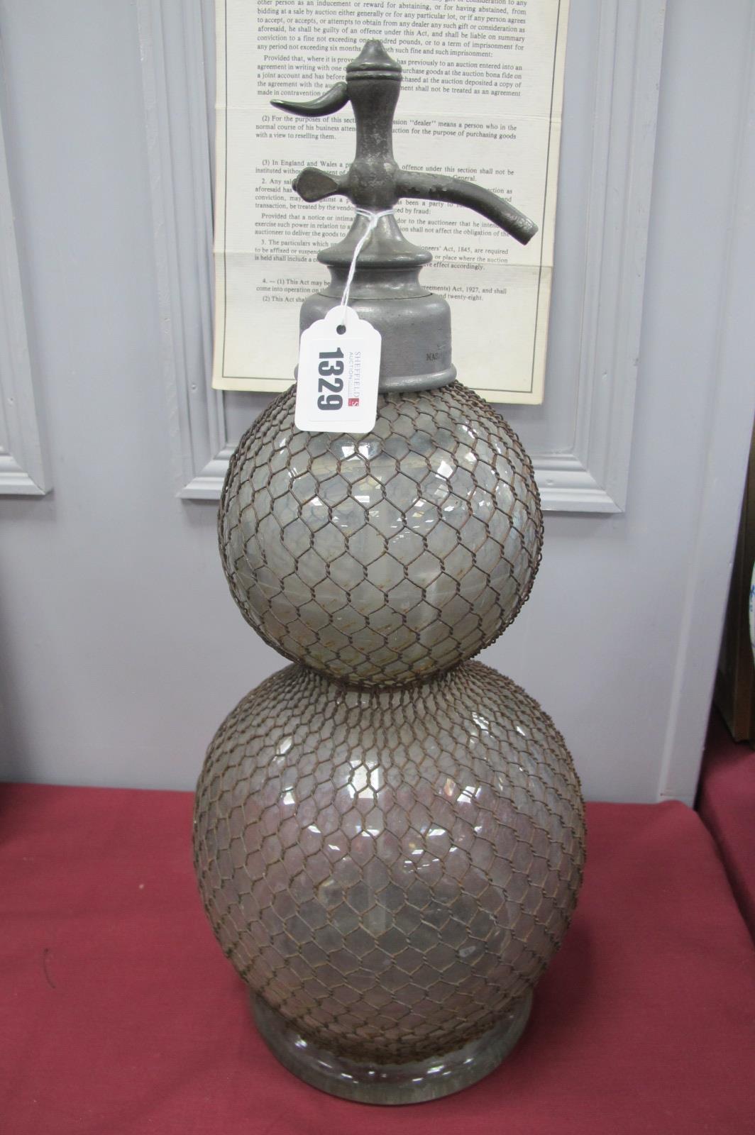 A Circa 1920's Double Gourd Shaped Soda Syphon with net covering 'Veritable Seltsogene D. Fevre,