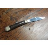Stan Shaw; A Single Blade Lock Knife, polished horn scales, brass linings, engraved bolsters,