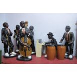 A Glazed Pottery Jazz Band, comprising six musicians, piano, bongo drums, the tallest 55cm.