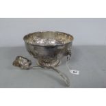 A Silver on Copper Twin Handled Circular Punch Bowl, with chased decoration and lion mask and ring