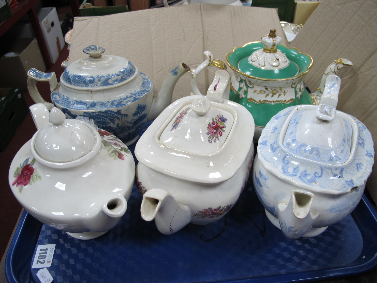 A XIX Century Rockingham Tea Pot, (damaged), XVIII Century blue and white tea pot (damaged), other