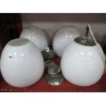 A Set of Four Vintage White Opaque Glass Ceiling Lights, of ovoid form, with fittings, 26cm wide.