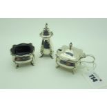 A Hallmarked Silver Three Piece Cruet Set, (marks rubbed) of shaped design, on pad feet. (3)