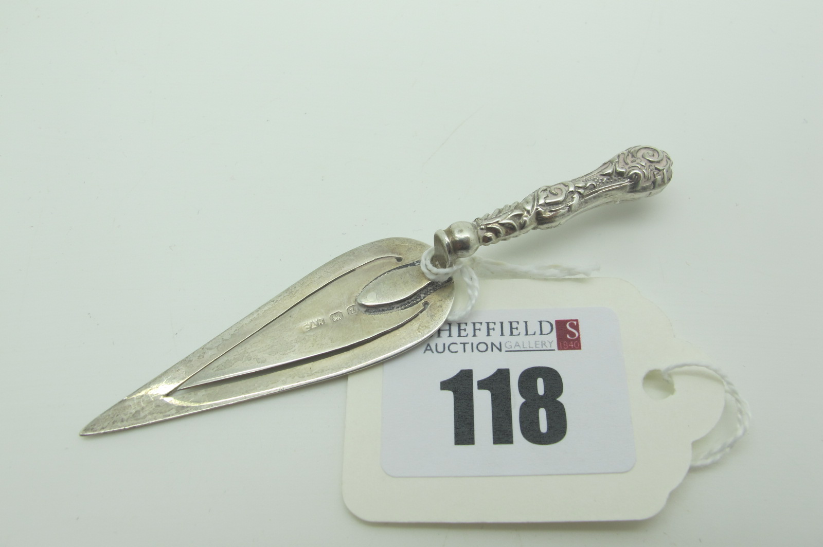 A Novelty Hallmarked Silver Trowel Book Mark, with texture handle.