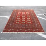 Kashan Super Tasselled Rug, with allover geometric motifs, on rust ground, 236 x 170cm.