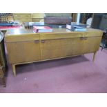 Nathan Teak Sideboard, circa 1970's, with cupboards flanking three drawers, on tapering legs, 183.