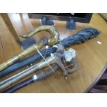 A Naturalistic Shepherds Crook, with gilt metal crucifix to top; Another with nautical carved crook;