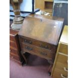 A Mahogany Bureau, with fall front fitted interior, over two drawers, on cabriole legs having