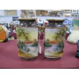 A Pair of Noritake Vases, with landscape scenes, blue and gilt tops and bases, 22cm high.