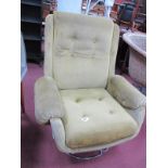 Schreiber Easy Chair, upholstered in a gold button back velvet, on pentagonal chrome base.