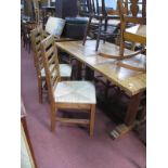 A Kitchen Table, 160cm wide, and four ladder back chairs.