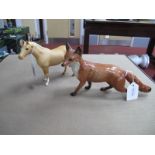 A Beswick Fox, 13cm high, plus Palomino Horse, 13cm high. (2).