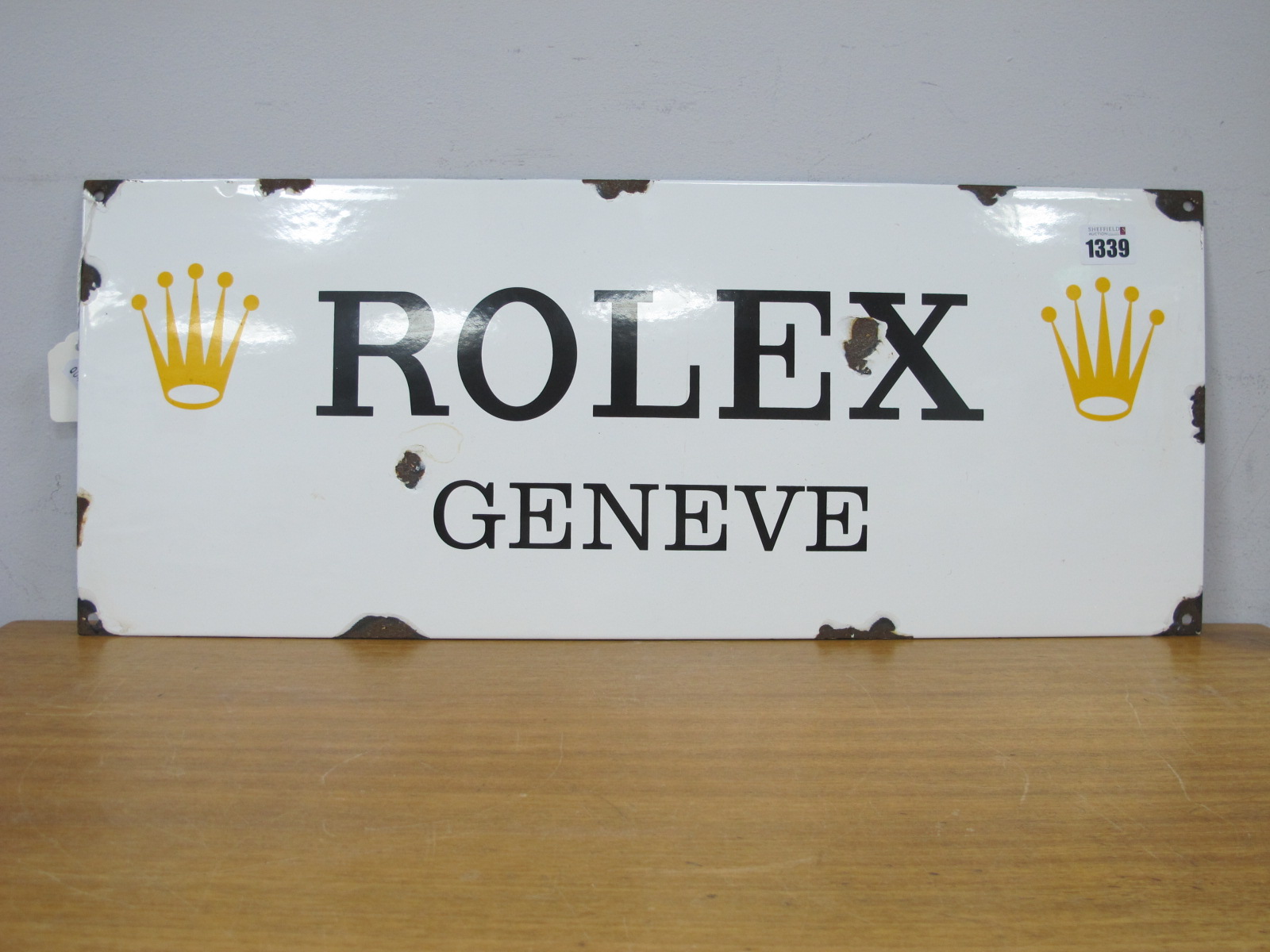 Rolex/Enamel Sign, white with black lettering, gold Rolex logo's, 60 x 24cm.