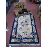 A Chinese Wool Tassled Rug, with floral motifs on beige ground 151 x 89cm, EVII tapestry furs:-