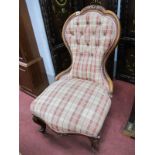 A Walnut Framed Spoon Back Chair, with carved cresting, re upholstered in a button back check