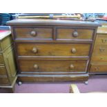 A XIX Century Mahogany Chest, of two small and two long drawers, having turned handled, and low back