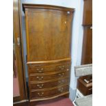 Walnut Drinks Cabinet, circa mid XX Century with bowed cupboard over four drawers on bracket feet,