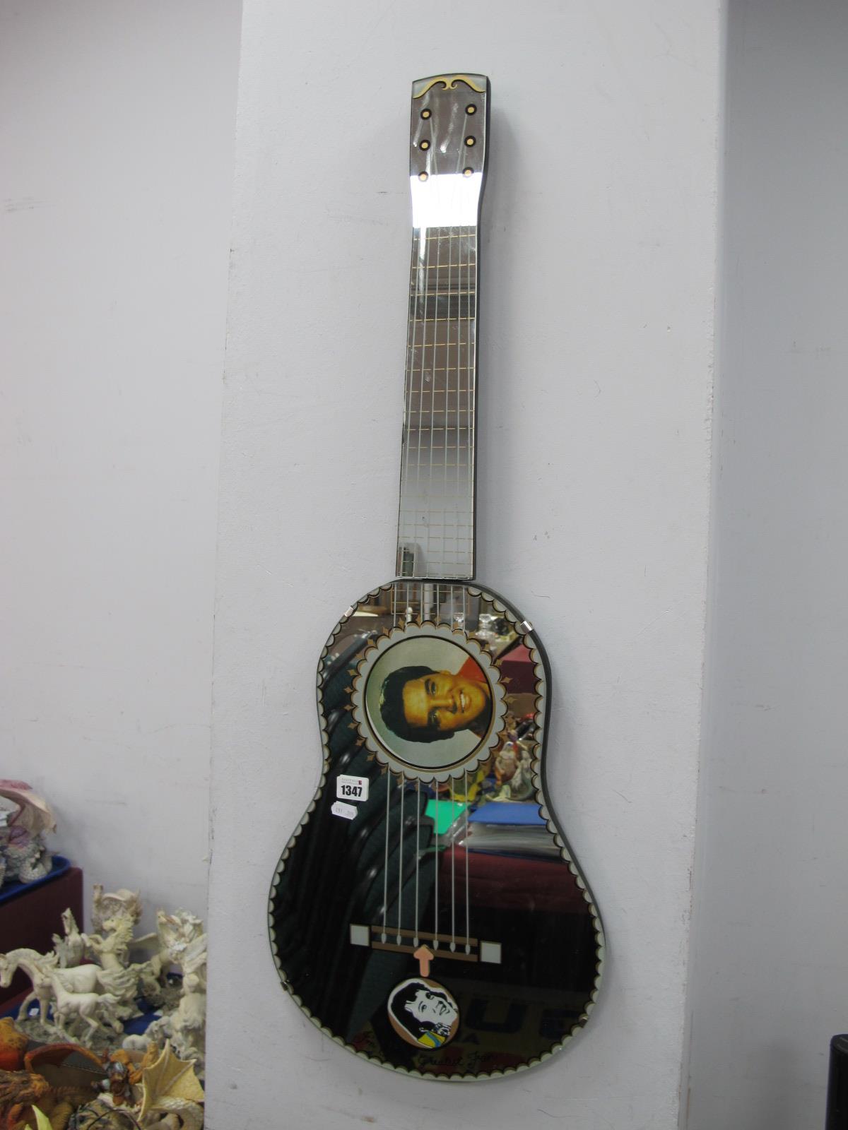 A Rare 1980's Elvis Presley Guitar Shaped Mirror, with photo of Elvis and aperture for personal