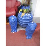 A Pair of Blue Glazed Terracotta Barrel Shape Planters, 48cm high, pair of similar lions. (4).