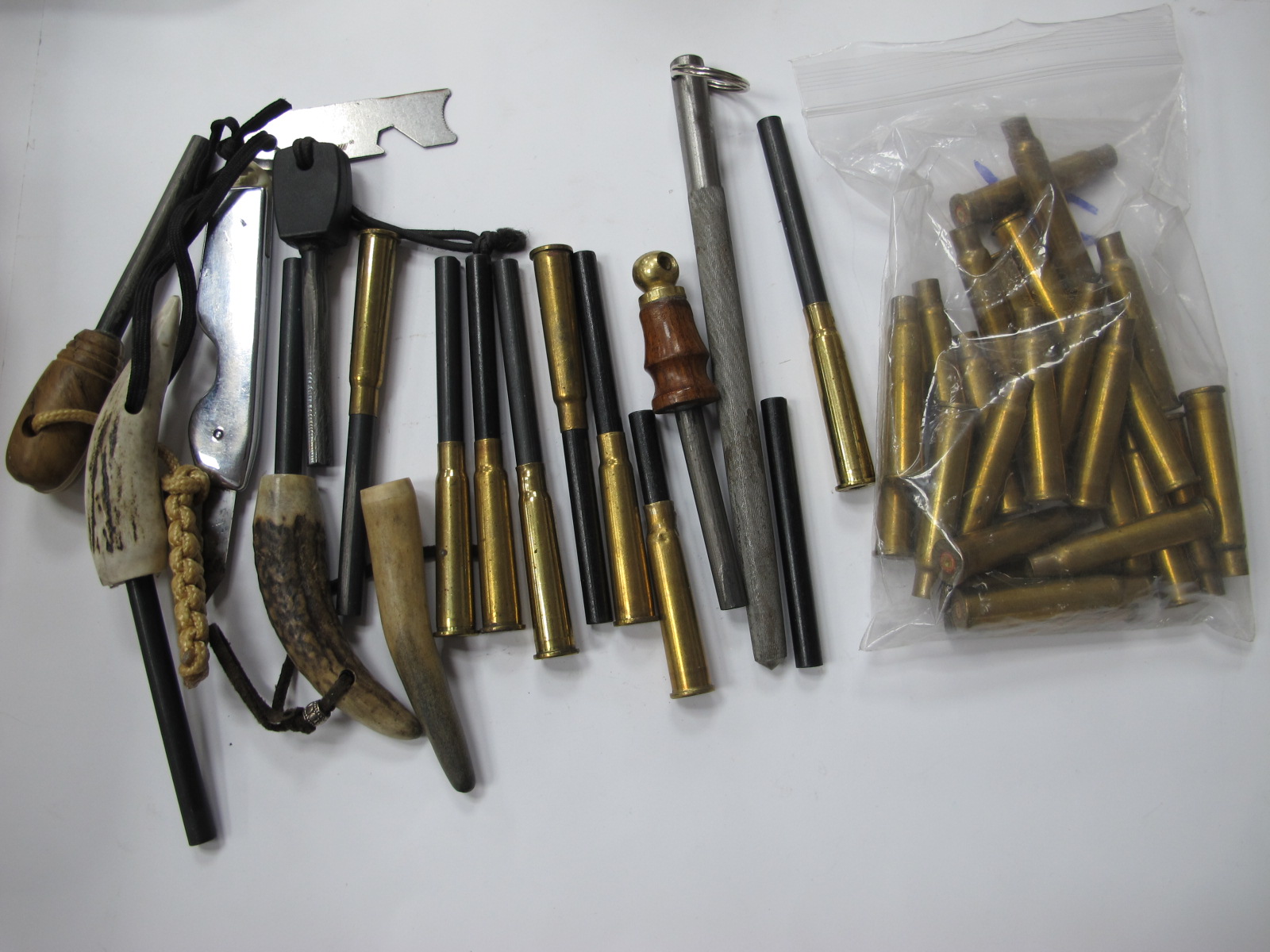 Military 303 Rifle Brass Blanks Shells, with a quantity of fire starting flints.