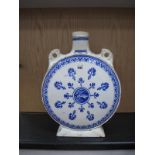 A Minton Pottery Moon Flask Vase, in blue and white with bird to centre and flowers surrounding (