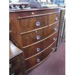 XIX Century Mahogany Bow Fronted Chest of Two Short and Three Long Graduated Drawers, having glass