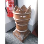A Chimney Pot, in glazed earthenware, with crown top and square base, 68cm high.