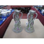 A Pair of Japanese 'Nippon' Vases, with raised decoration and three twist handles, 25cm high.