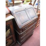 Reprodux Oak Bureau, with fall front over four drawers, 61cm wide.