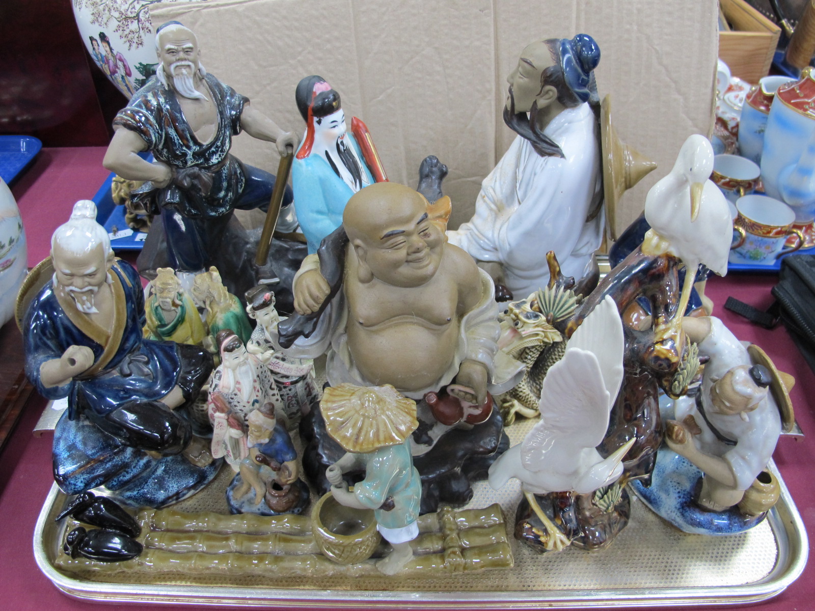 A Collection of Oriental Figures, pottery , resin, etc:- One Tray