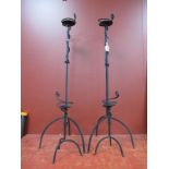 A Pair of Ironwork Candle Holders, on Trefoil base, 99cm high; another smaller pair, similar. (4)