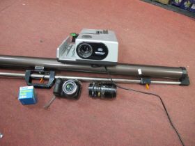 Tokina 70-210mm Lens, Fuji film camera, Braun projector, tripod screen.