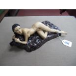 A Peggy Davies Erotic Figurine 'Tamora' on a Bearskin Rug, limited edition No 36/100, 25cm long.