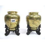 A Pair of Early XX Century Chinese Brass Vases, of ovoid form incised and decorated in panels with